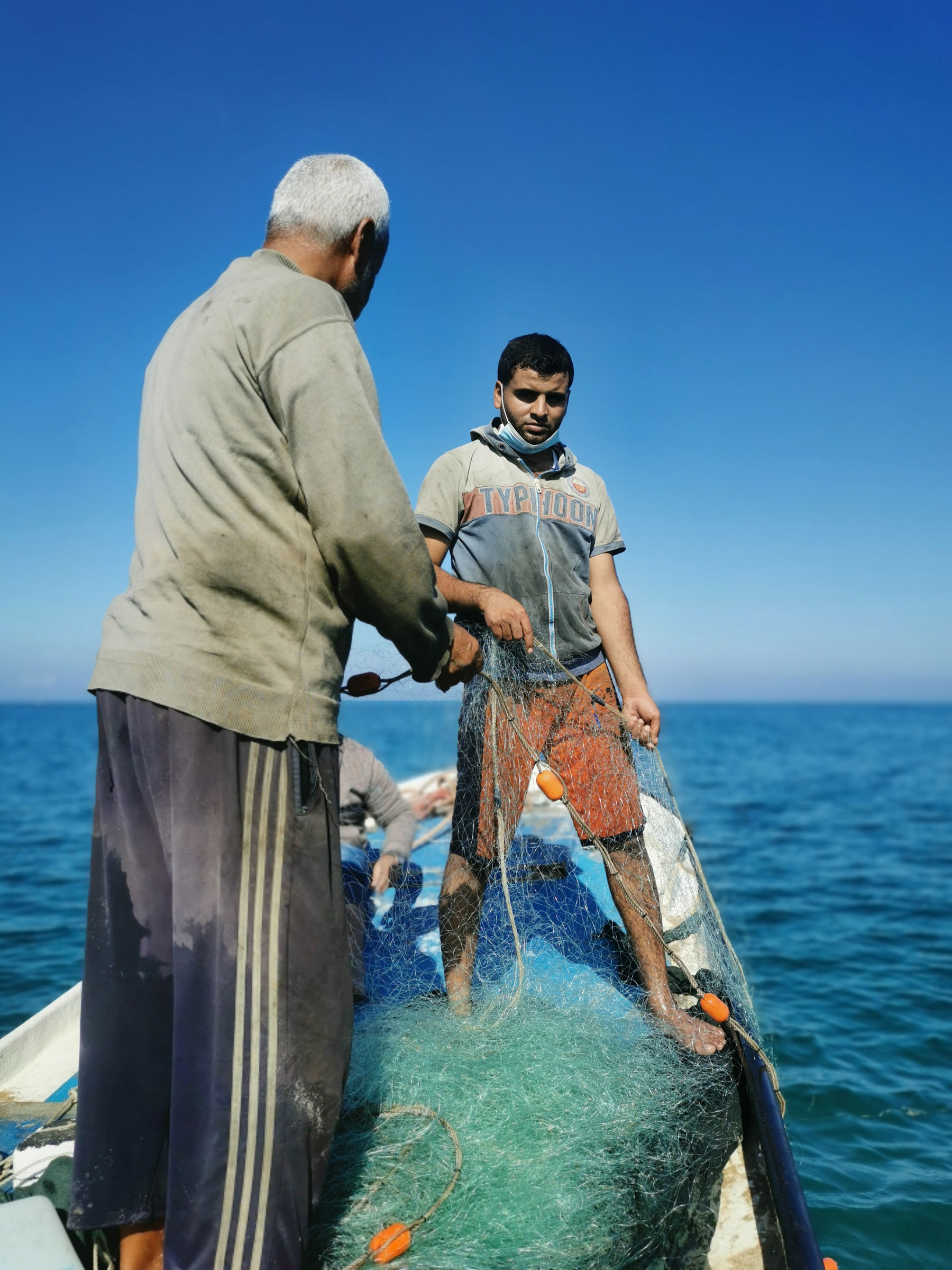 Shadi Qanan working with his father.