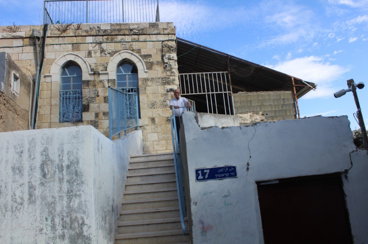 Mr. Salah in front of his family home from which he was evicted. Photo by OCHA