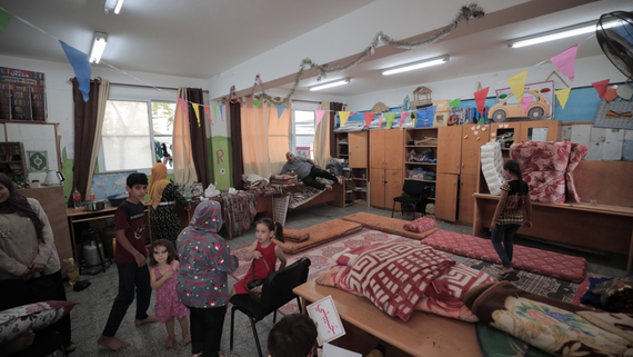 Displaced people staying in a school. Photo by UNRWA/Mohammad Hinnawi