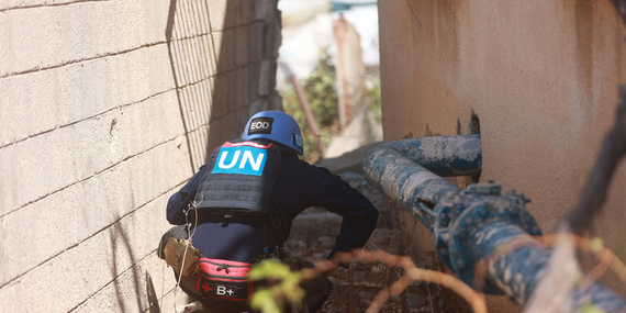 A Mine Action specialist inspects a water well compound in Khan Younis for potential explosive hazards following the ceasefire, in support of humanitarian and recovery efforts, 19 October 2025. Photo by UNMAS 