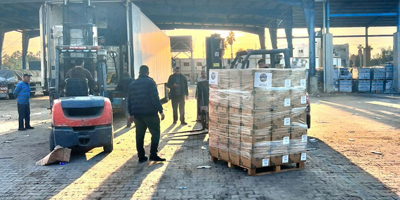 In December 2023, packages of food are prepared for delivery to people taking shelter in communal spaces. Photo: ACTED