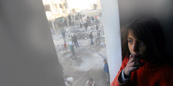 Girl looking at destruction site after Gaza 2008-2009 conflict, February 2009. © Photo by UNICEF