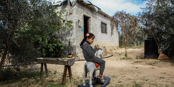 Four-year-old Leen Abu Hajras playing in front of her home in Khan Younis, the Gaza Strip, following her recovery from malnutrition. Photo by Mohammed Al Reefi for the Catholic Relief Services.