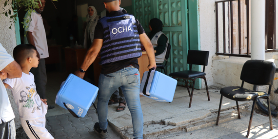 An OCHA staff member dispatching polio vaccines in Deir al Balah area of the Gaza Strip. Photo by OCHA/Themba Linden, 2 September 2024