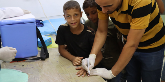 Vaccinating children for polio in Gaza. Photo by OCHA/Themba Linden