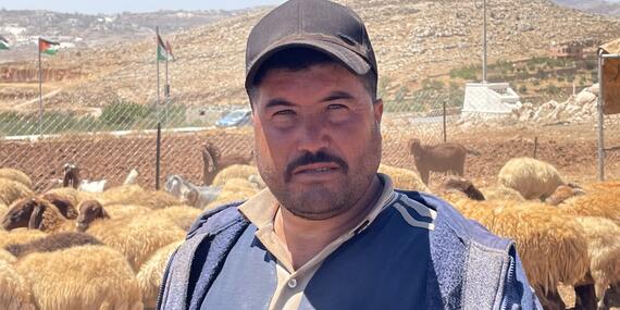 Ammar Abu ‘Alia, resident of Ras al Tin who left with his family in recent days. This photo was taken where he is currently staying with relatives, guarding his herd. Photo by OCHA, 9 August 2023