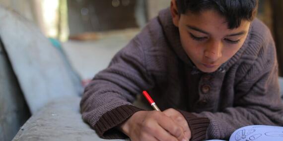 Rajab is re-committed to education. OCHA
