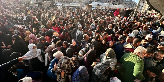 Amid desperate conditions, people queue for bread outside one of the few UN-supported bakeries still operating in Gaza. Photo by UNRWA