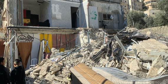 A two-storey residential building demolished by its Palestinian owners due to the lack of an Israeli-issued building permit, in Silwan, East Jerusalem. Six households, comprising 39 people were displaced. 5 January 2025.Photo: OCHA.