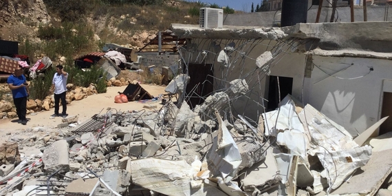 Demolition of an extension of a house in Beit Hanina, East Jerusalem, on 26 June. Photo by OCHA.