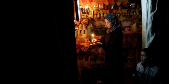 Power cut in Ash Shati refugee camp, 2014. Photo by Wisam Nassar