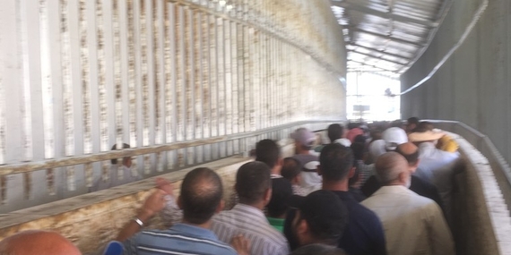 Gilo checkpoint, Palestinians accessing East Jerusalem for the Ramadan Friday prayer, 3 July. Photo by OCHA.