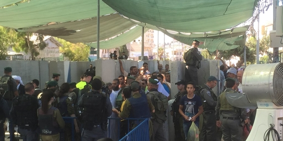Gilo checkpoint, Palestinians accessing East Jerusalem for the Ramadan Friday prayer, 3 July. Photo by OCHA