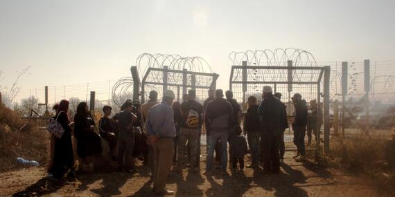 Farmers waiting to access their olive groves behind the Barrier, next to Beit Surik village (Ramallah), 31 October, 2019. ©  Photo by OCHA