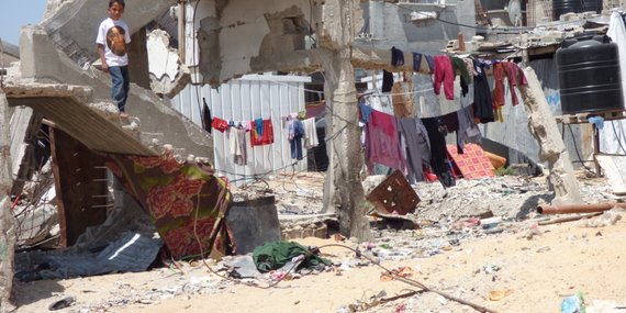 IDPs living makeshift in shelters next to their destroyed homes, Beit Hanoun. Photo by OCHA