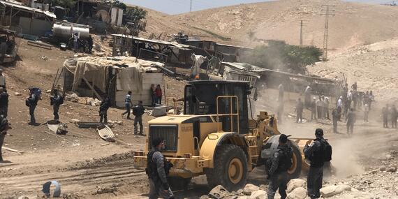 Israeli forces leveling land next to Khan Al Ahmar, in preparation for the demolition of the community, 4 July 2018. © Photo by JFF