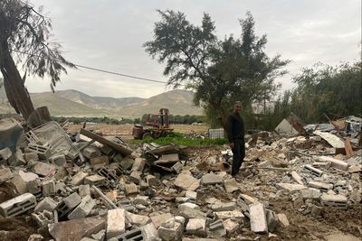 A Palestinian resident of Al Jiftlik-Abu al 'Ajaj, in Jericho governorate, following the demolition of his home for lacking building permits that are nearly impossible for Palestinians to obtain, 21 January 2025. Photo by OCHA