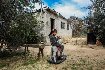 Four-year-old Leen Abu Hajras playing in front of her home in Khan Younis, the Gaza Strip, following her recovery from malnutrition. Photo by Mohammed Al Reefi for the Catholic Relief Services.