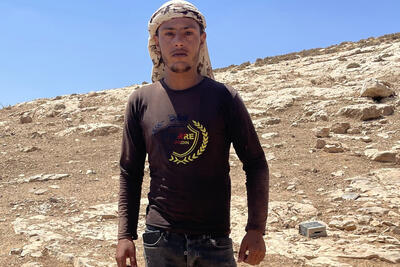 A member of the only Palestinian family remaining in Al Baqa’a following the displacement of most of the community amid settler violence. “We are not going anywhere,” he told us this week. Photo by OCHA