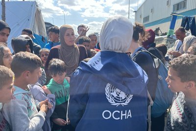 People in UNRWA’s logistics base in Rafah. Photo by OCHA