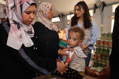 A Palestinian child being screened for malnutrition in Khan Younis, as new supplies arrived following almost 80 days of full blockade on any cargo entering the Gaza Strip. Photo by UNICEF, 25 May 2025