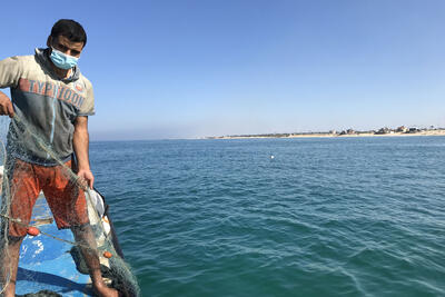 Shadi Qanan on his repaired boat.