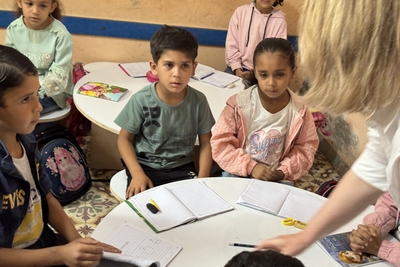 Children in Khan Younis attending one of 219 temporary learning spaces set up as alternatives to formal schools, currently serving 117,000 learners. Photo by OCHA/Olga Cherevko