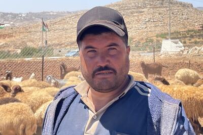 Ammar Abu ‘Alia, resident of Ras al Tin who left with his family in recent days. This photo was taken where he is currently staying with relatives, guarding his herd. Photo by OCHA, 9 August 2023