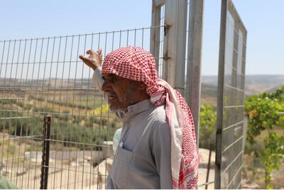 Abu Waleed, farmer and leader of the Queela community, near his house. Photo: ACF
