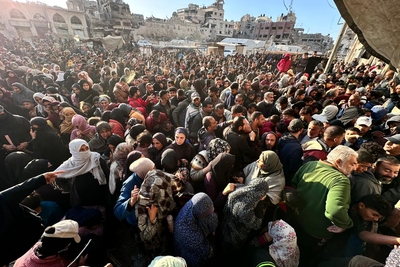 Amid desperate conditions, people queue for bread outside one of the few UN-supported bakeries still operating in Gaza. Photo by UNRWA