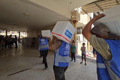 UNRWA Team providing assistance to displaced families in Al- Tabi’een school in Gaza city. Photo: UNRWA
