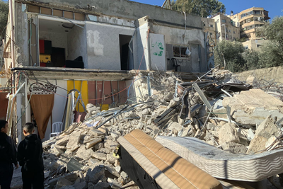 A two-storey residential building demolished by its Palestinian owners due to the lack of an Israeli-issued building permit, in Silwan, East Jerusalem. Six households, comprising 39 people were displaced. 5 January 2025.Photo: OCHA.