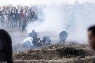 Demonstrators overcome by teargas at the Gaza fence, March 2019.