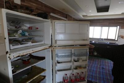 Sabreen shows her empty fridge. 3 December 2020, Gaza City. Photo by GPC