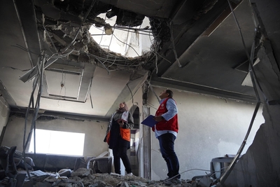 Initial assessment of damaged caused to a house during the escalation in Gaza. 13 May 2023. Credit Palestine Red Crescent Society