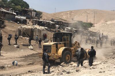 Israeli forces leveling land next to Khan Al Ahmar, in preparation for the demolition of the community, 4 July 2018. © Photo by JFF